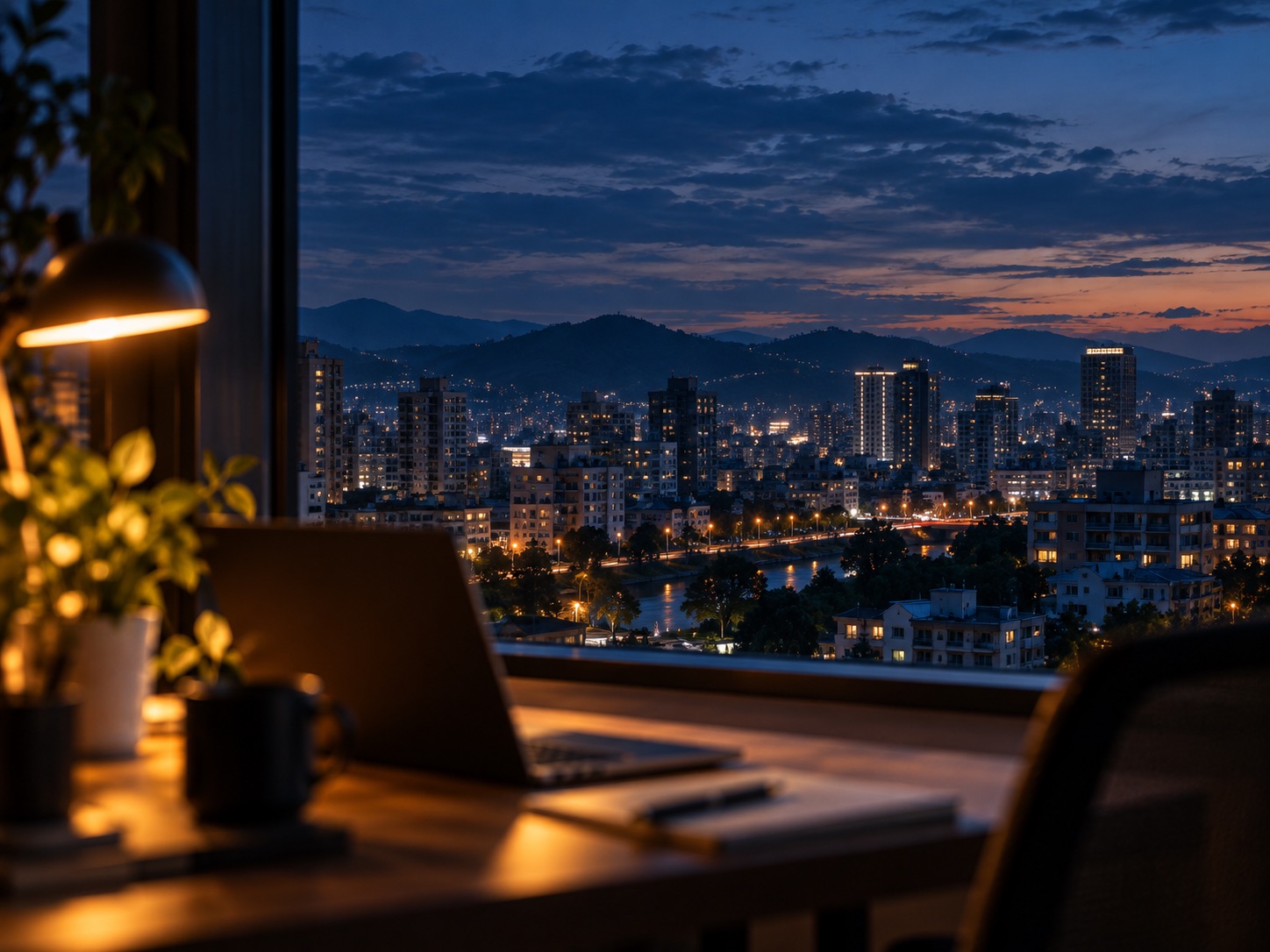 View from the office window over Taichung and distant hills at dusk